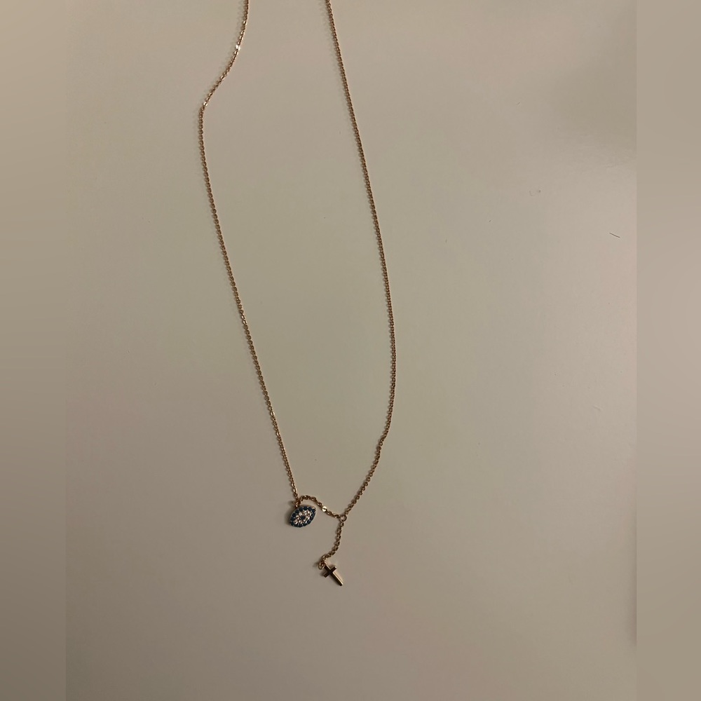 NWOT Rose Gold Evil eye and cross necklace. 16” length. Comes with box.